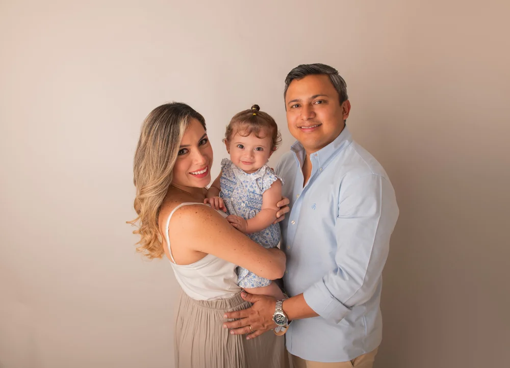 expecting mother in flowing gown at golden hour maternity session Orlando